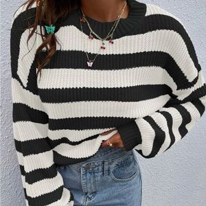 balck and white, never worn. great condition.